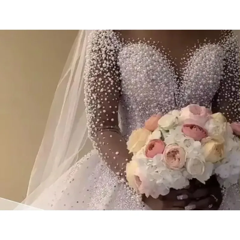 Customized Pearls Beaded Ball Gown Bridal Dresses Saudi Arabia Sheer Neck Illusion Long Sleeves Bridal Wedding Gowns