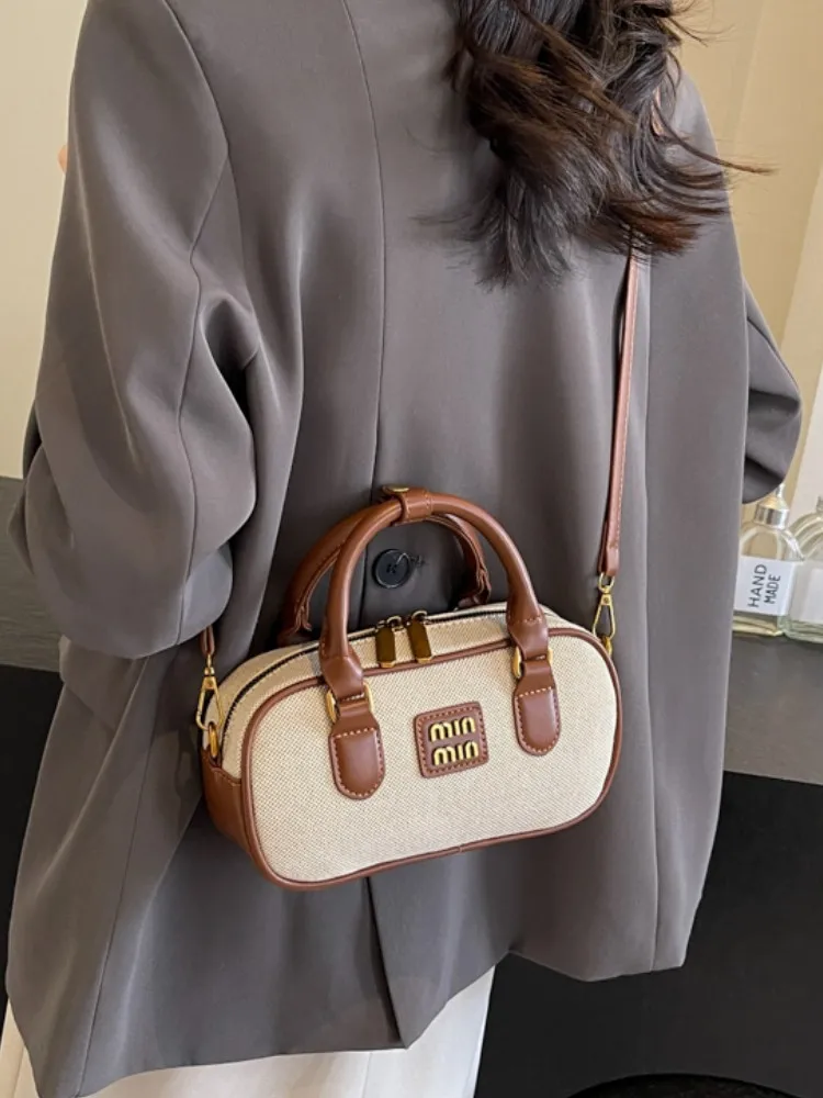 Hand-carrying bowling bag female famous brand 2025 summer new retro fashion shoulder bag high-end trend all-match messenger bag