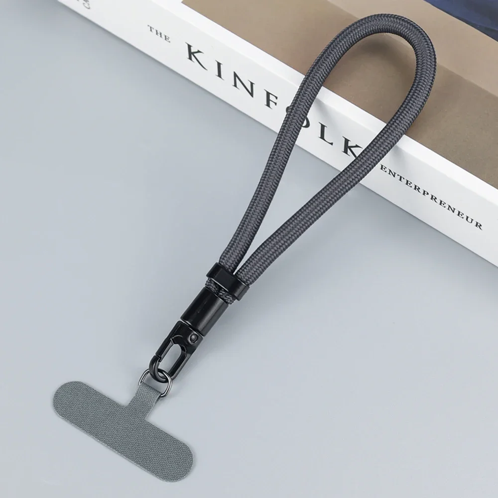 Universele verstelbare mobiele telefoonkoord, korte polsband met zelfsluitend anti-drop ontwerp, duurzame polyester telefoonriem