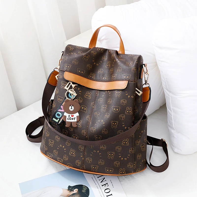 Cartoon trend bear print women backpack, texture anti-theft all-in-one travel backpack, playful bear hanging ornaments