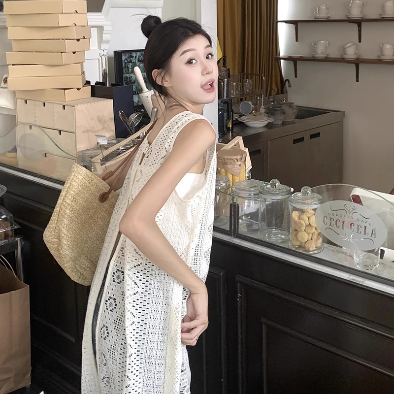 Abito resort senza maniche in pizzo 2025 Boho Abiti da Mujer Moda Estate Abito sottile Femmes Scava fuori Loose Vedi Abito trasparente