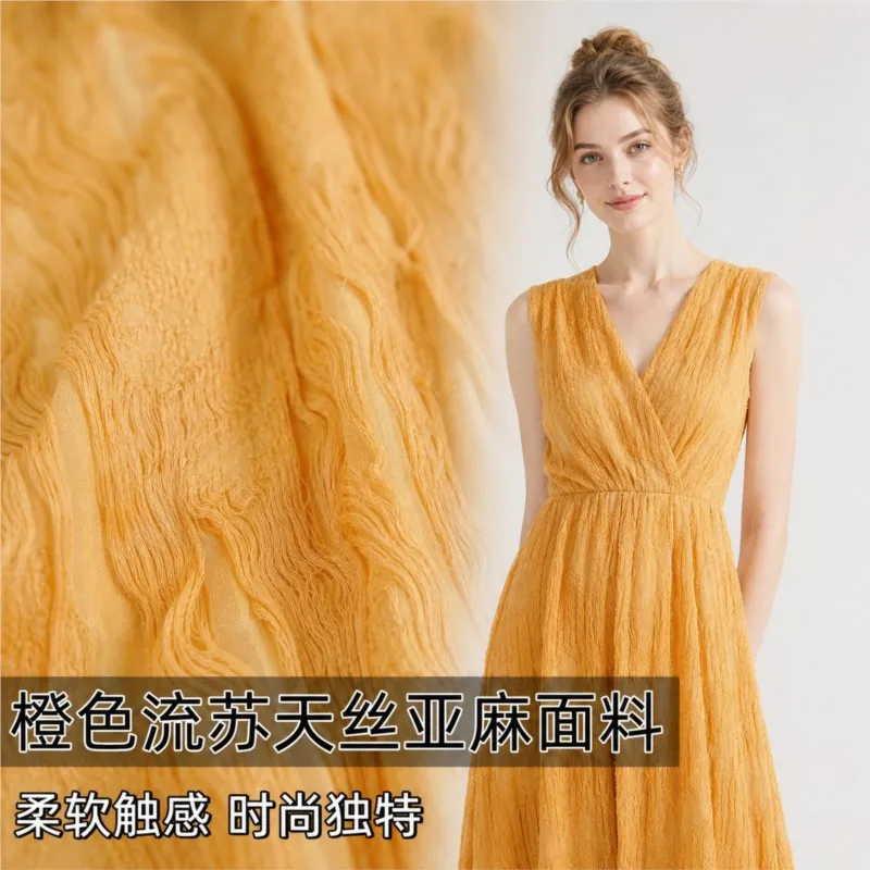 Orange fringed linen cut-out fabric for dresses shirts and evening gowns a designer's fashionable