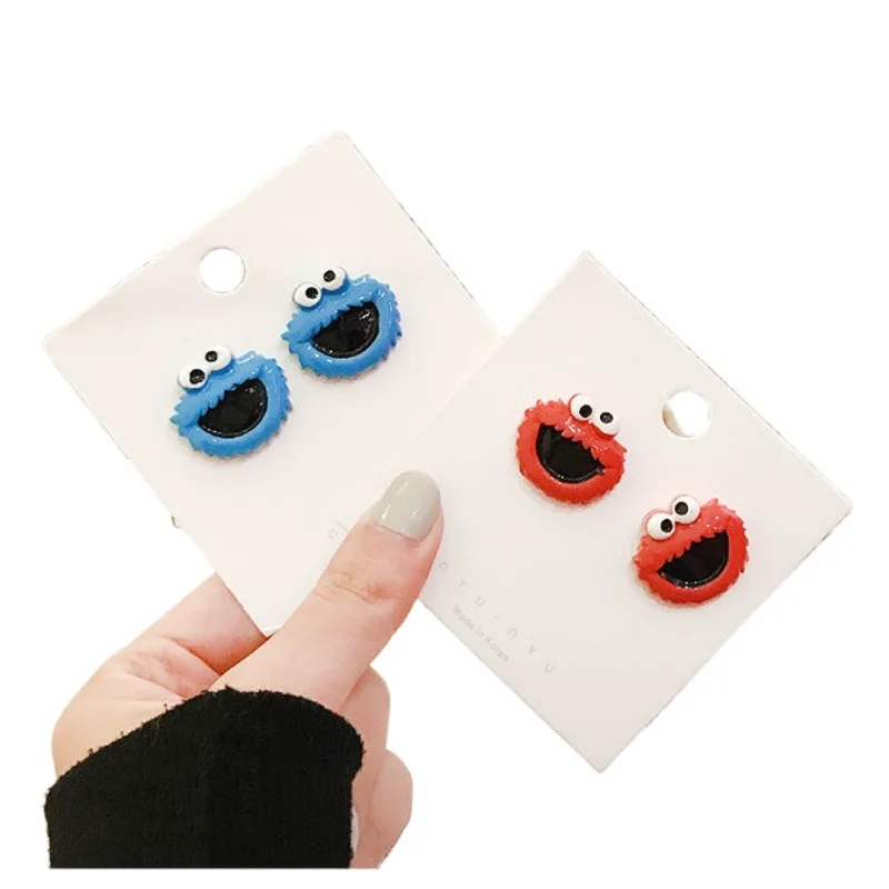 Barrio Sésamo Elmo Cookie Monster anime periférico muñeca de dibujos animados estilo pendientes para niños y niñas accesorios de alto valor regalos