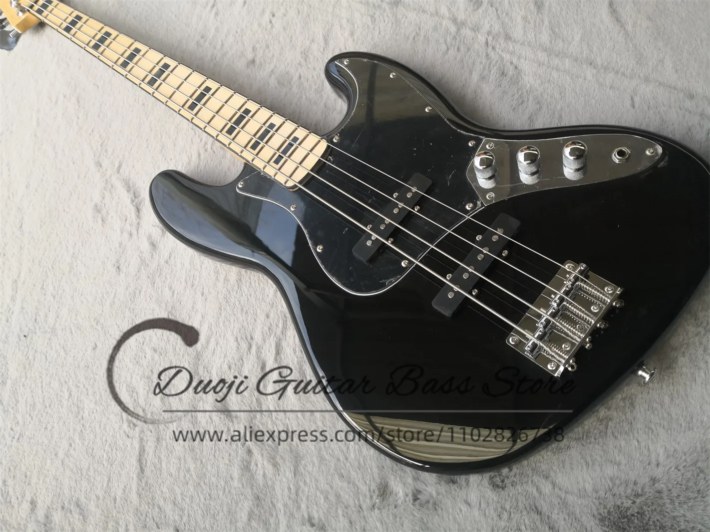 4 string black bass guitar, solid wood body, maple neck, black square inlaid maple fingerboard, fixed bridge, black guard