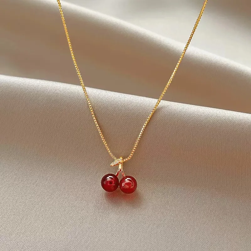 The 2025 summer classic sweet wine red cherry pendant necklace is a fashionable and individual fruit golden chain necklace for w