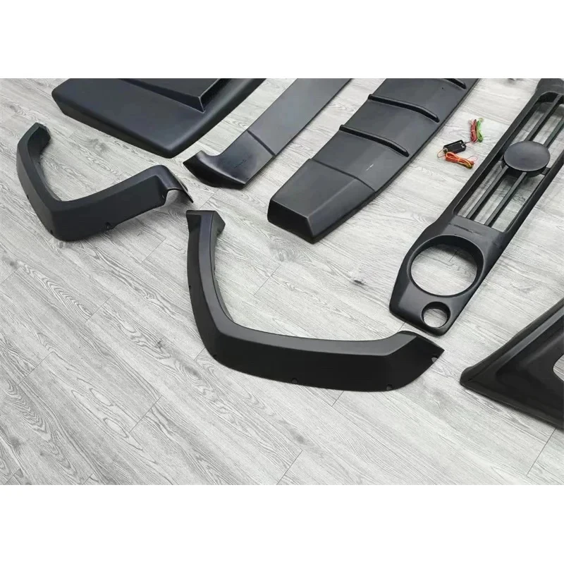 

Jim Body Kit: Resin-Primed Front and Rear Bumpers, Widebody Flares, and Rear Spoiler