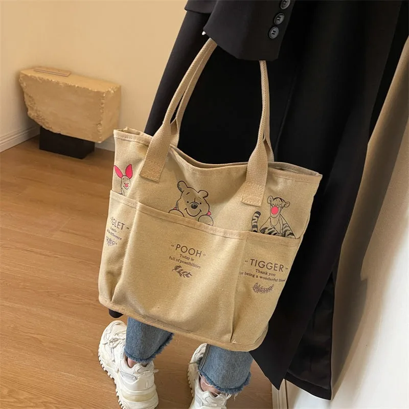 Disney new cartoon Winnie the Pooh retro fashion tote bag women\'s large-capacity canvas commuter shoulder bag