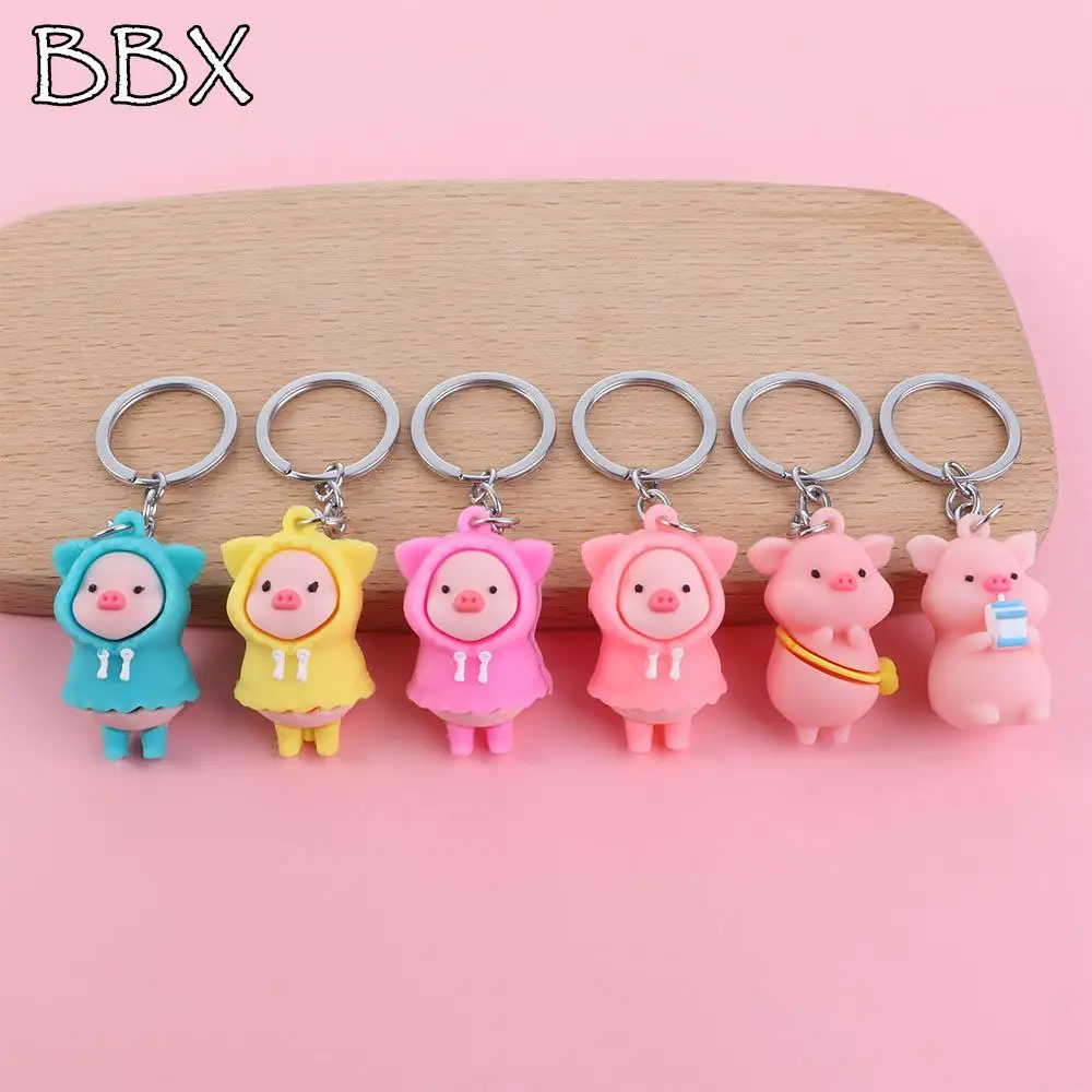 

Cute Cartoon Raincoat Pig Doll Soft Rubber PVC Keychain Pink Yellow Blue Trinket Girls Boys Pendant Bag Bag Car Keyring Jewelry