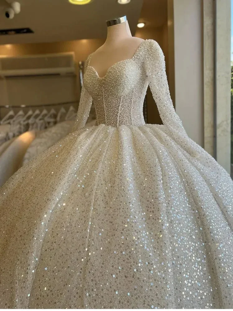 Customized 2025 Sweetheart Heavy Pearls Sequins Ballgown Wedding Dresses Robe De Mariée Illusion Full Sleeves Luxury Bridal Gown