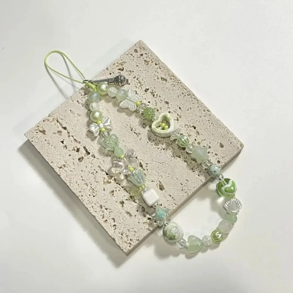 الأخضر زهرة شريط لتعليق الهاتف المحمول الحبل لطيف Kawaii فراشة سحر المفاتيح حالات ل IP 15 Airpods سماعات Ins كوريا الساخن اليدوية