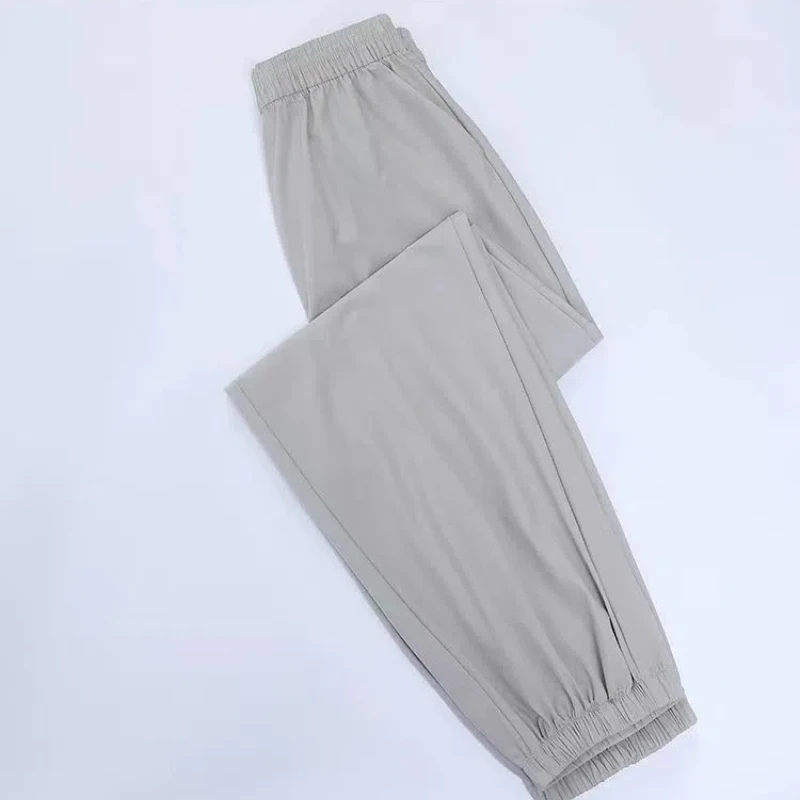 Summer Ice Silk 2024 Women's New Splicing Elasticized High-waisted Pocket Printed Fashion Loose Minimalist Casual Straight Pants