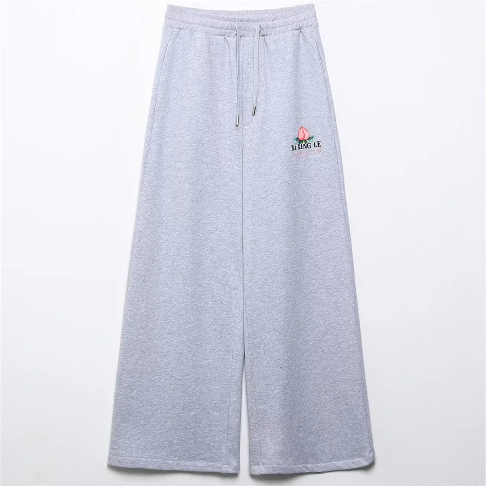 เสื้อผ้าผู้หญิงใหม่สำหรับฤดูใบไม้ร่วง สไตล์ยุโรปและอเมริกา เสื้อสเวตเชิ้ตปักลายพิมพ์ กางเกงจ็อกกิ้งทรงหลวมขายาว