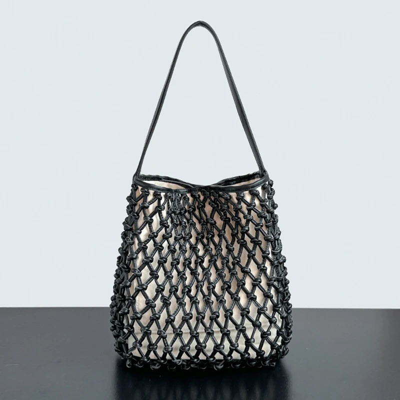 

Cowhide hand-woven underarm bag 2025 new niche design genuine leather hollow vacation beach bag fashionable ladies shoulder bag