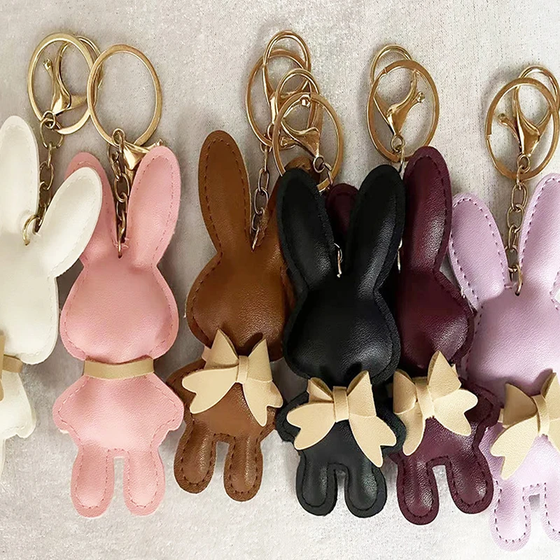 Bestseller 1 Stück Niedlicher PU-Leder Einfarbiger Hasen-Schlüsselanhänger Kreativer Schleifenhasen-Schlüsselring Auto-Schlüsselhalter Anhänger Taschencharme Geschenke
