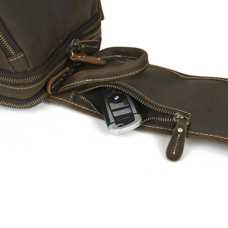 حقائب صدر كلاسيكية بكتف واحد من جلد البقر الأصلي باللون البني مع جيوب متعددة بسحاب وحزام قابل للتعديل