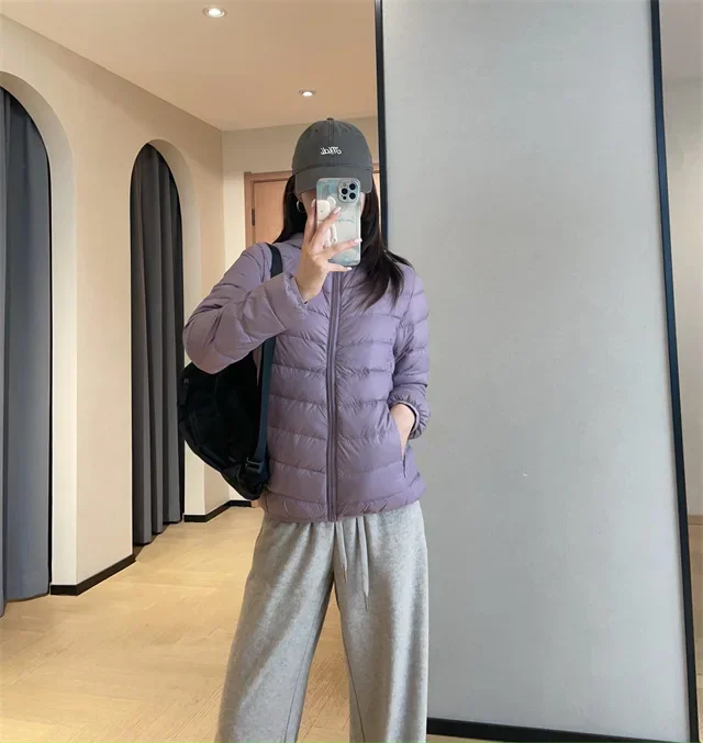 Giacca imbottita leggera da donna stile corto outdoor casual 90% piumino d'anatra bianca stile gilet tessuto in nylon chiusura con cerniera con cappuccio