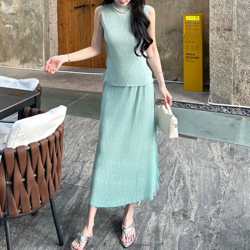 Damski bezrękawnik Miyake + modna spódnica w kształcie litery A, dwuczęściowy zestaw 2025 Summer New Wave Solid Color Folded Two Piece