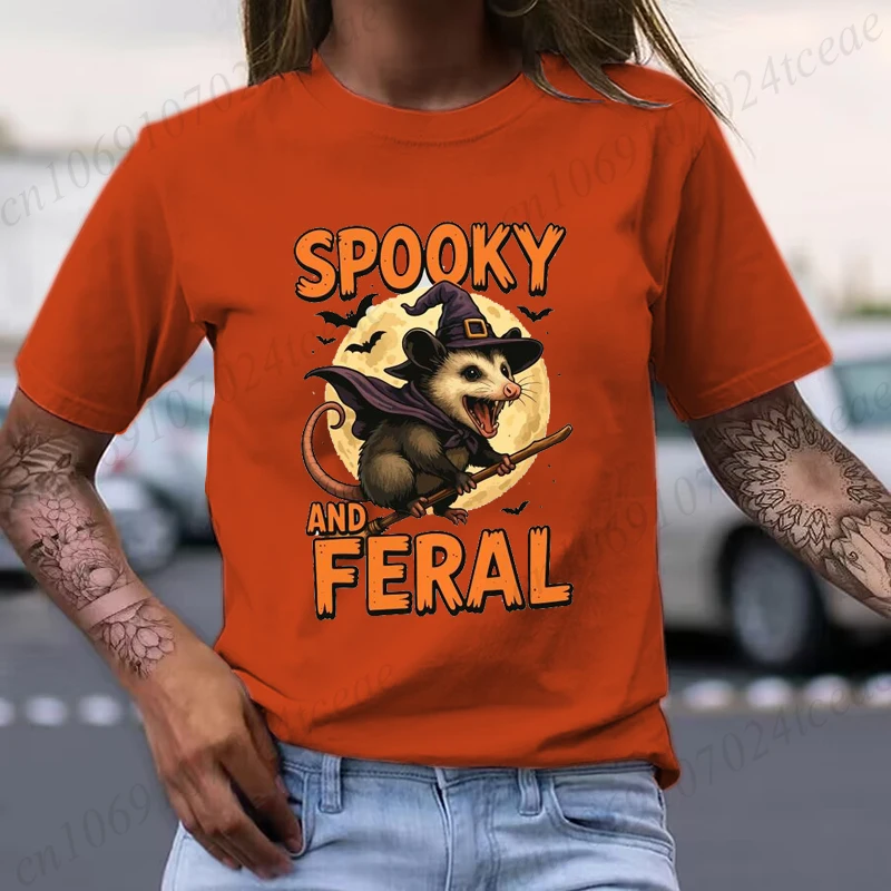 

Spooky and Feral Possum Shirt Funny Halloween Witch Animal Tee T-Shirts Screaming Opossum on Broom Graphic T Shirt for Women