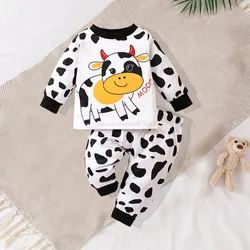 Two piece cute and fashionable black and white spotted cow print long sleeved round neck top and pants set for baby boys
