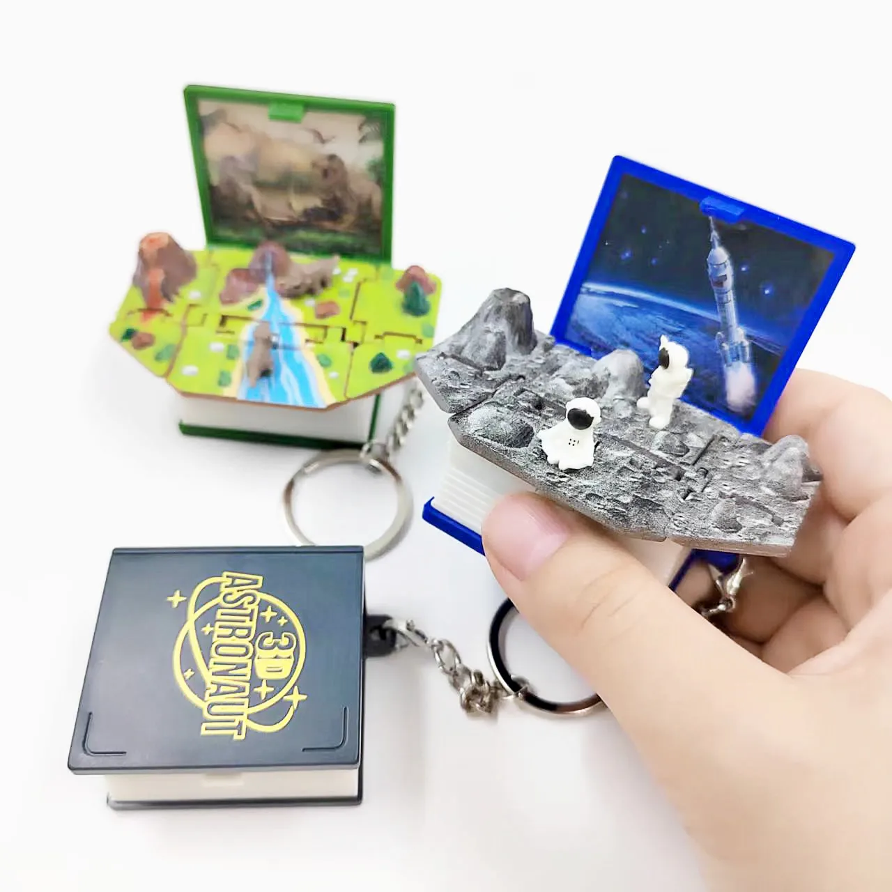 Novelty Mini Dinosaur Space Key Chain Toy Kids Game Toys Pop Out 3D Book Dino Astronaut Wacky Toys Trick Stress Reduction Toy