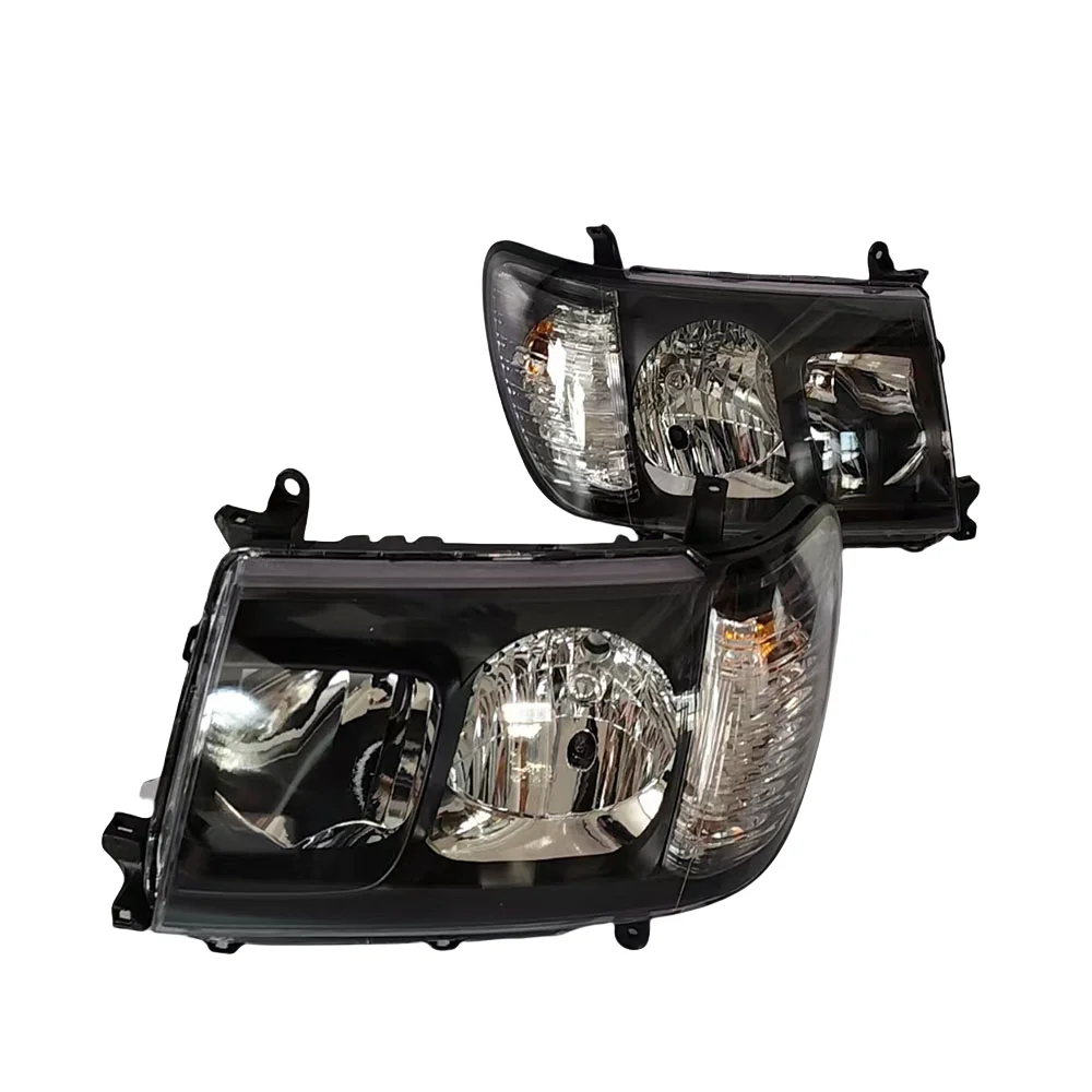A pair of black headlights specifically designed for the Land Cruiser LC100 FJ100 2005-2007 model