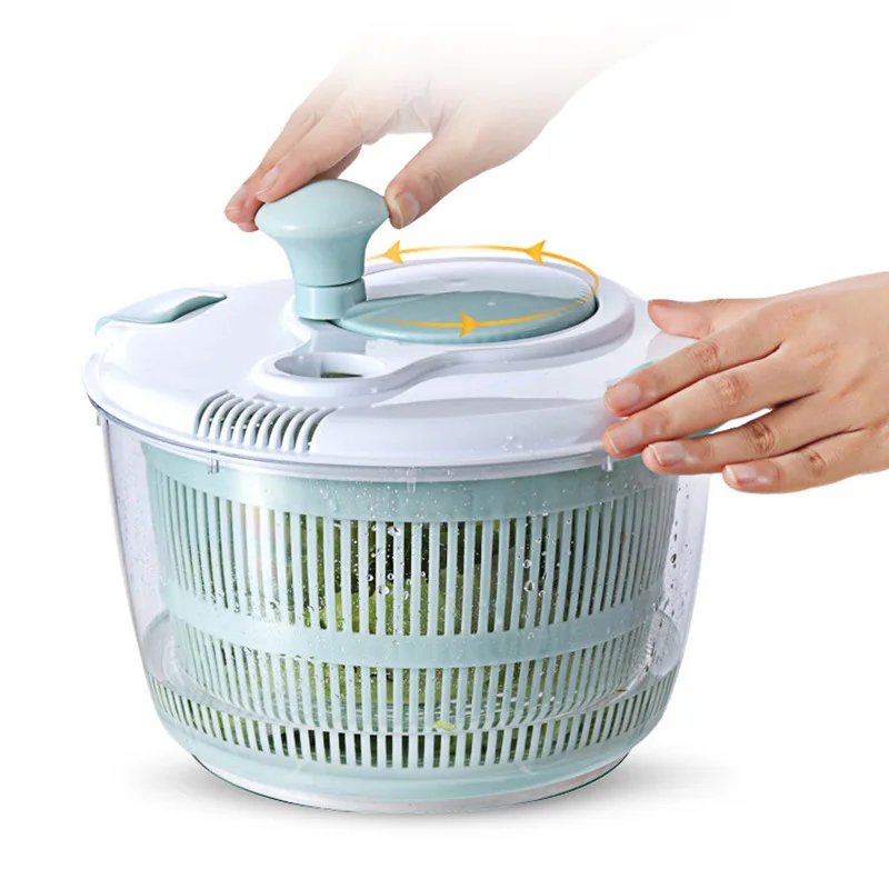 Manual kitchen spinner for fresh produce drying, compact plastic basin with ergonomic crank handle, efficient water removal from