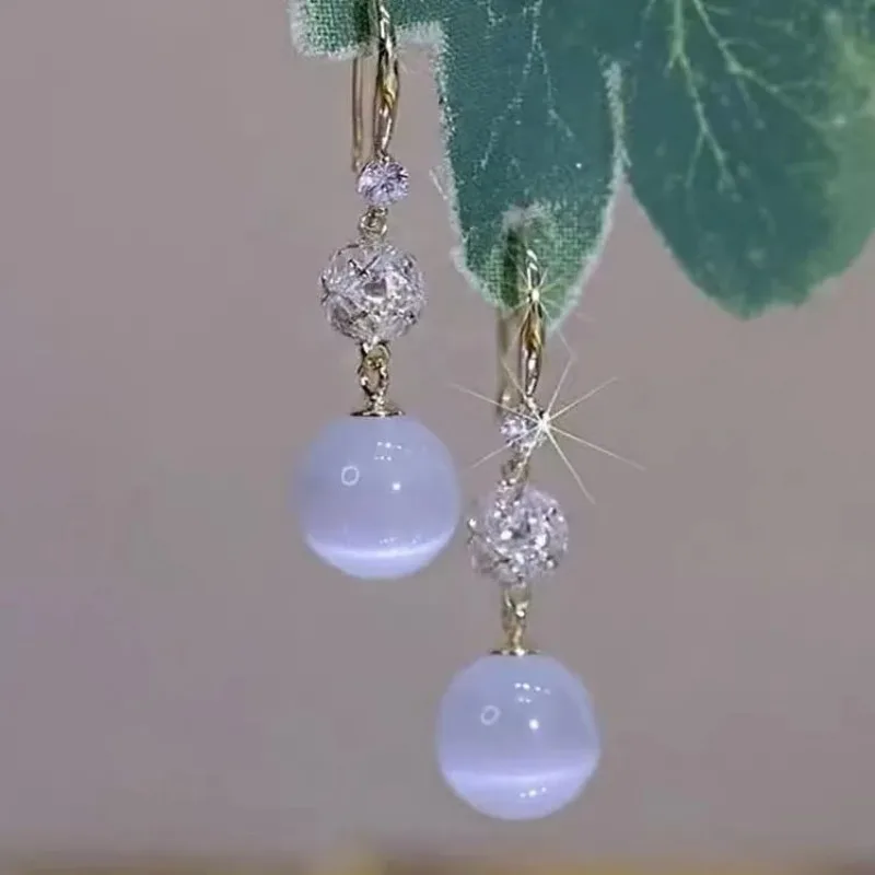 أقراط طويلة على شكل كرة أوبال 2026 أقراط عصرية جديدة على الطراز الأجنبي أقراط كلاسيكية فاخرة وخفيفة الوزن #4