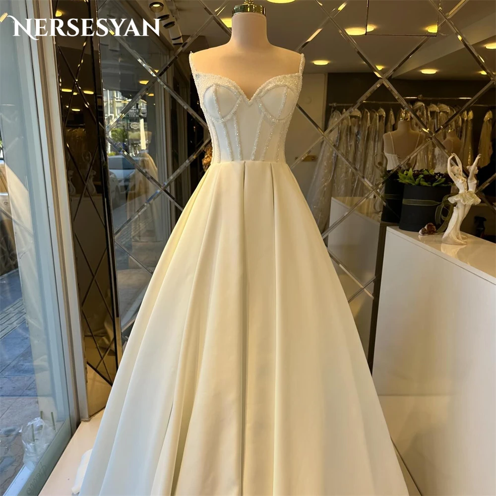 

Nersesyan Vintage Glitter Wedding Dresses V-Neck Spaghetti Straps Sparkly A-Line Bridal Gowns Backless Sleeveless Bride Dress