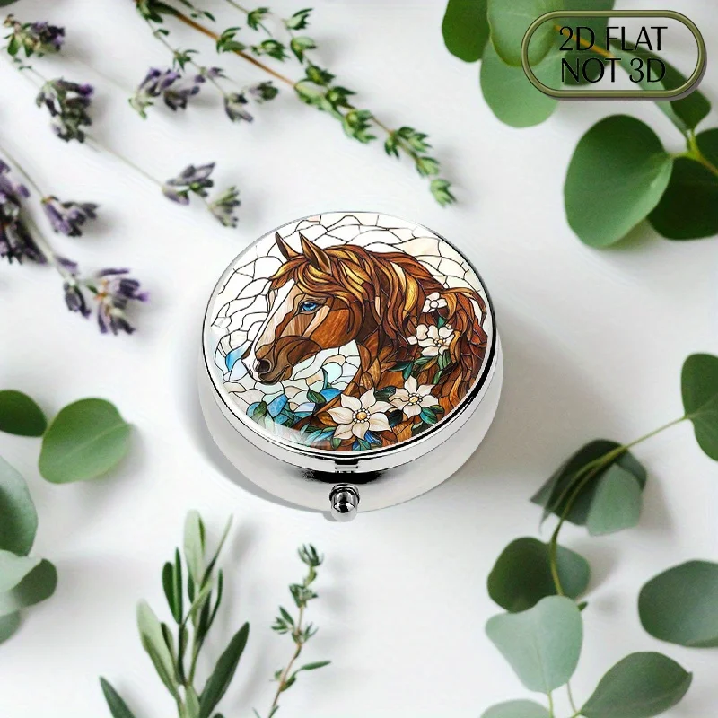 A flat, portable, round metal pill box featuring a brown Arabian horse with a blue tail, blue eyes, and white flowers. It's perfect for storing daily medication, essential vitamins, or small items, and makes a great summer holiday gift.