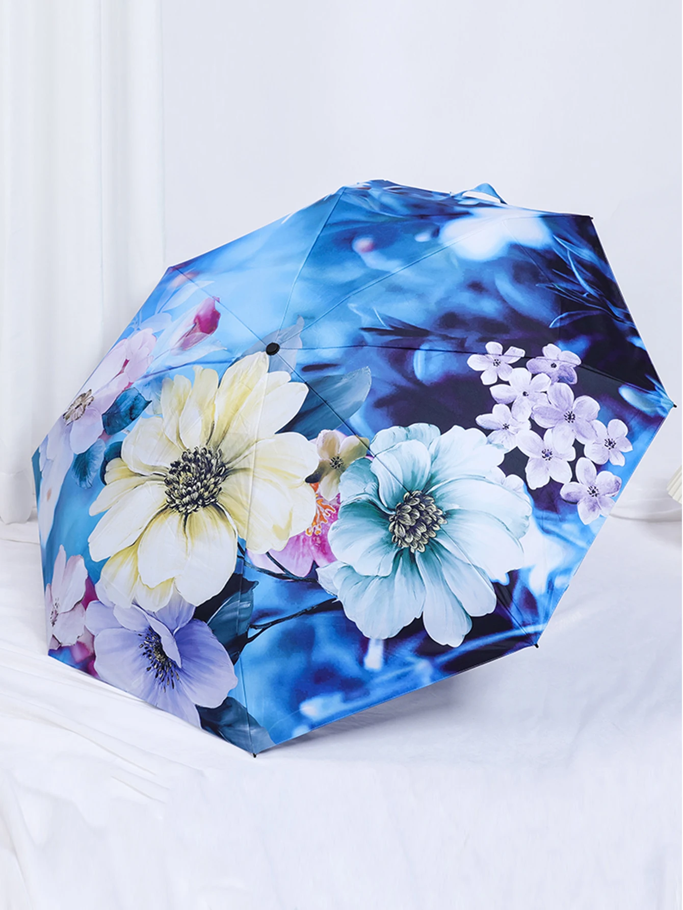 Double-layer fabric, double-layer printing, double-sided flower, thickened sunscreen coating, rain and sun protection umbrella