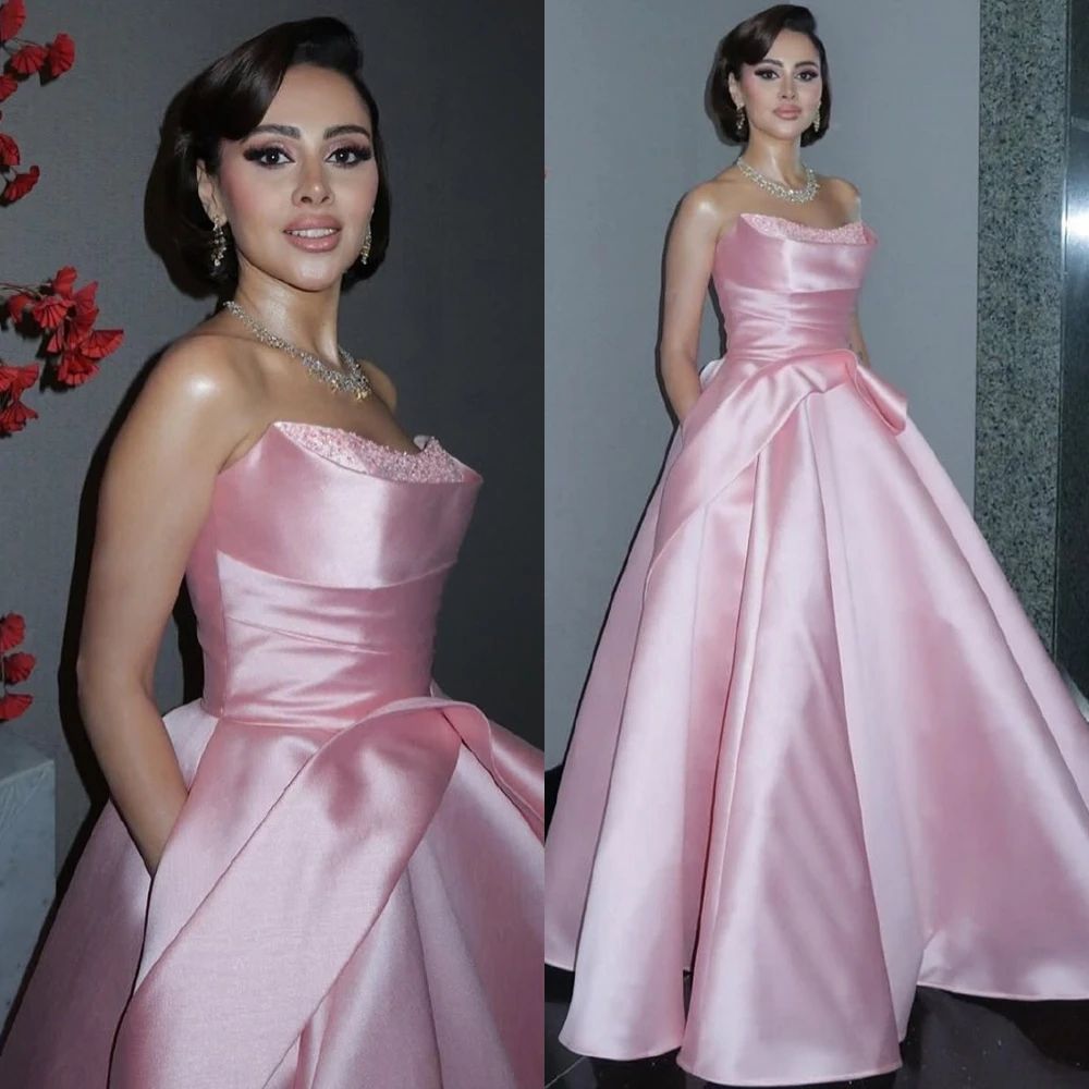فستان سهرة رائع من الساتان الوردي مخصص بدون حمالات فساتين المشاهير أنيقة على شكل حرف a للحفلات على الطراز الحديث بدون أكمام
