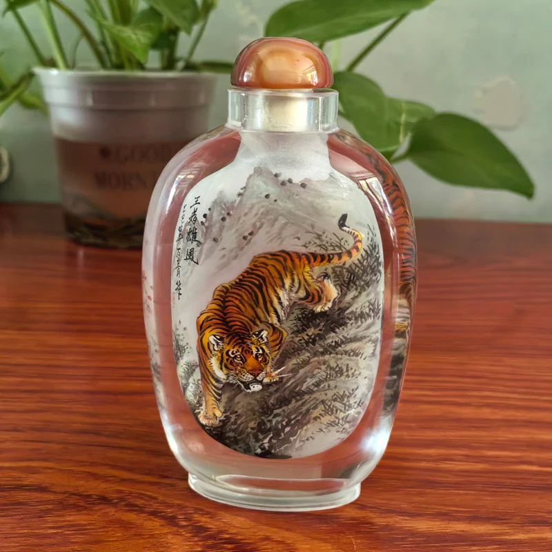 Chinese non cultural heritage snuff bottles, tigers pandas, handmade with a brush inside the bottle  Afraid of water and falling