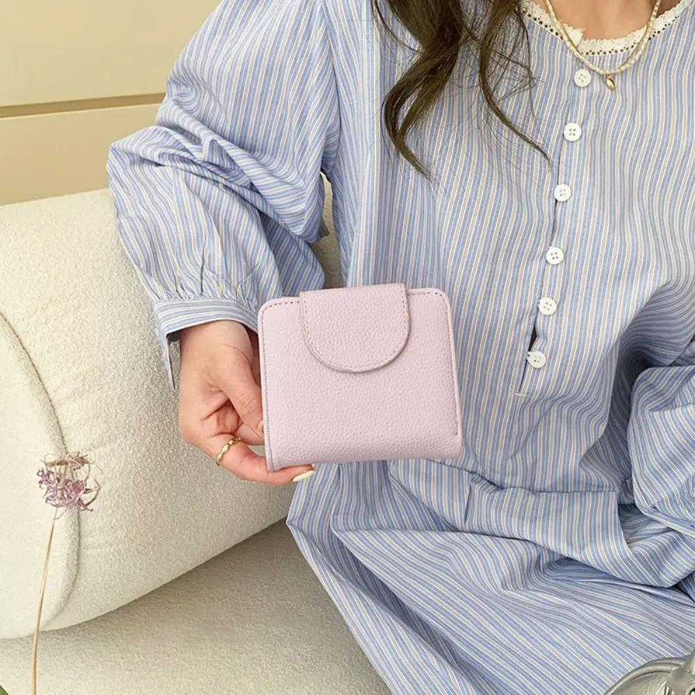 Modne portmonetki na monety ze skóry PU, zapinane na guzik, jednokolorowe portfele damskie o dużej pojemności, krótkie portfele damskie