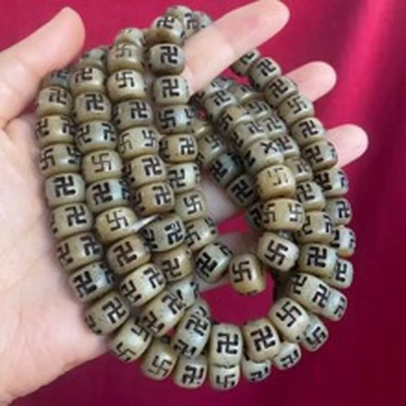 Tibetan-style cow bone bead with intricate carving, featuring a meteorite pattern used for DIY jewelry and bracelet making