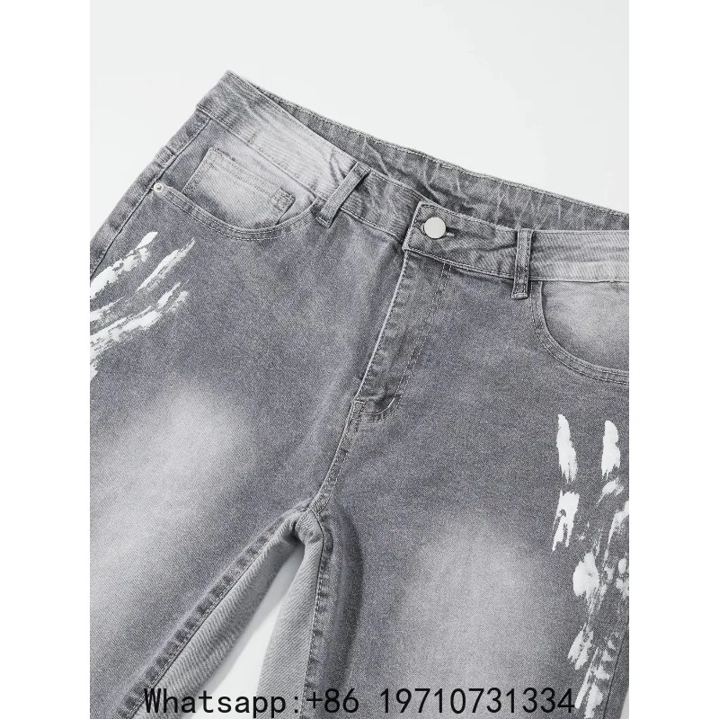 Trendy brand gray slightly flared jeans for men with splatter graffiti, frayed hems, loose fit, slimming casual long pants