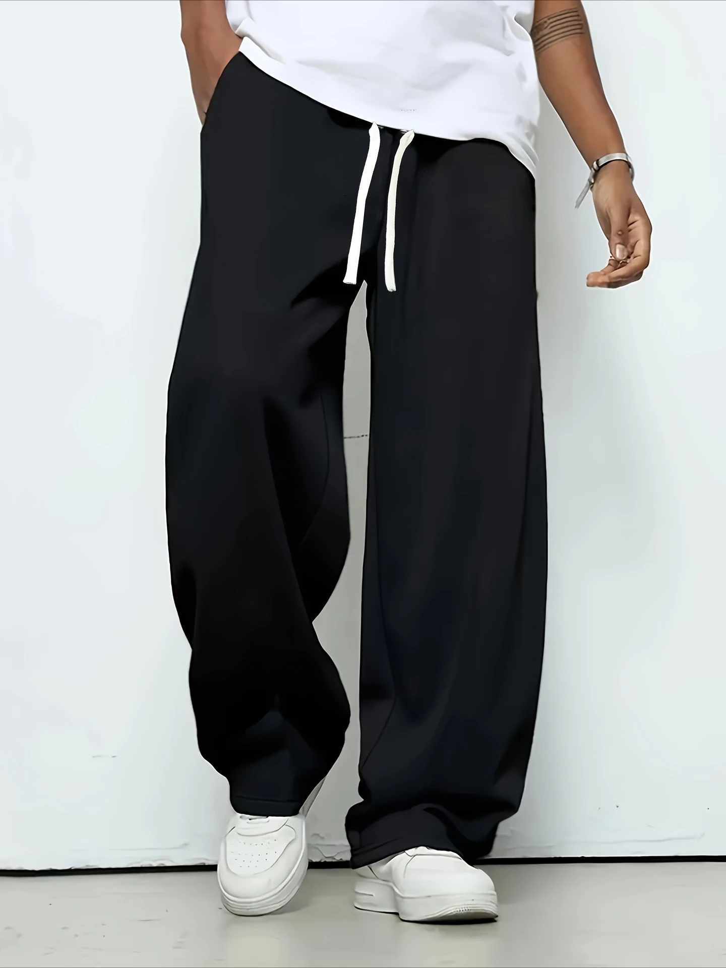 

Men's All-season Casual Trousers, Featuring a Solid Color Straight-leg Elastic Design with a Drawstring Waist. Made