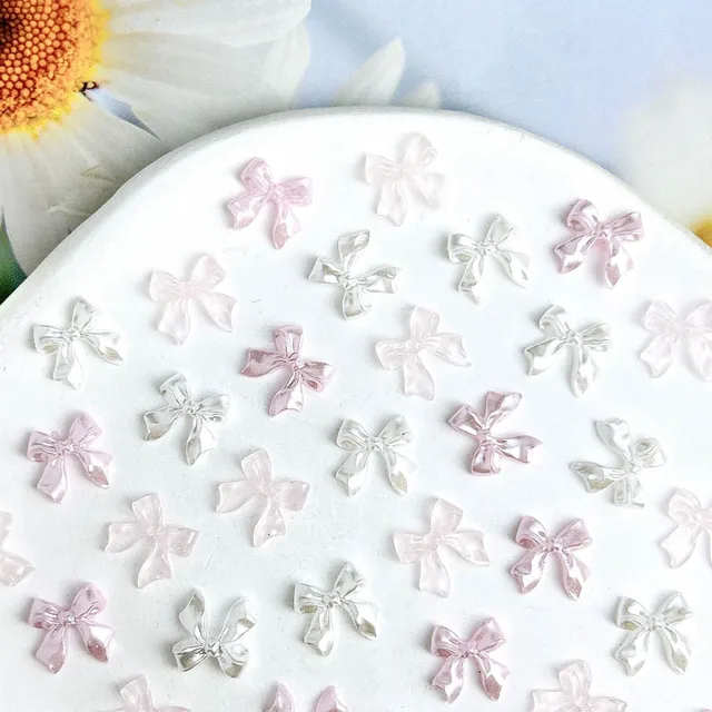 50 sztuk 3D Aurora przezroczysta żywica kokarda Nail Art Charms śliczny motyl brokatowe paznokcie materiały dekoracyjne biżuteria akcesoria DIY