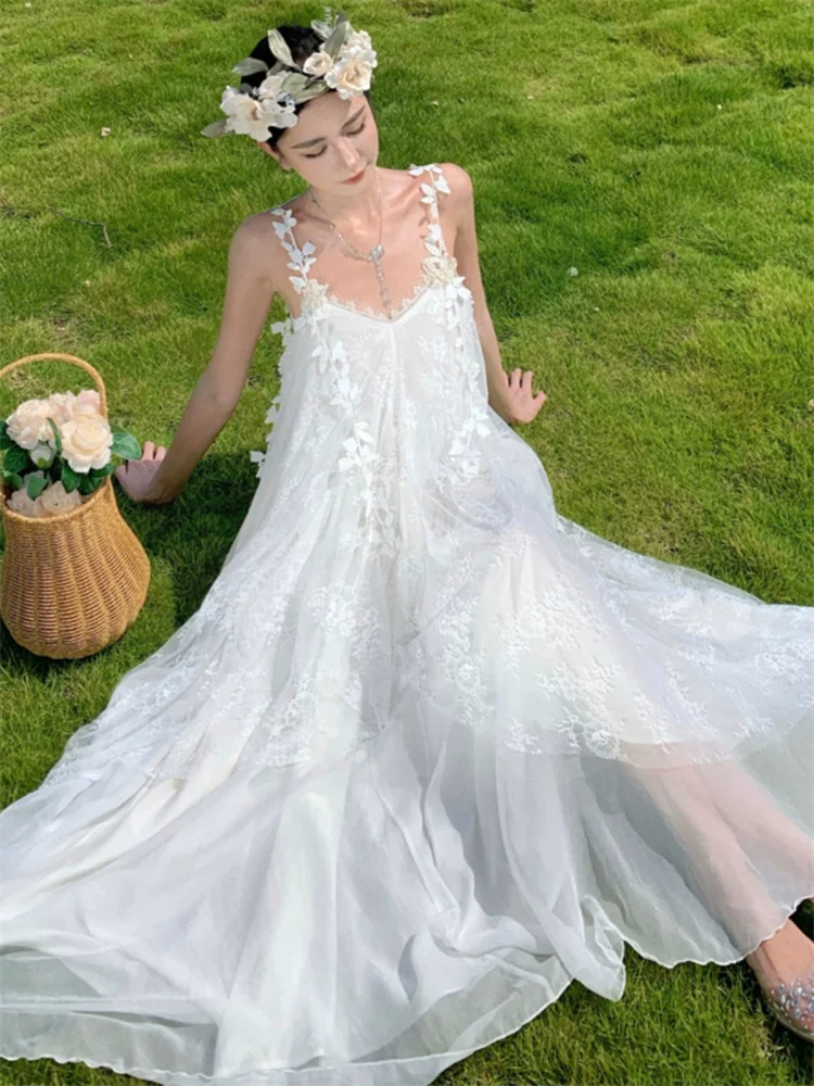 Robe de plage blanche Style Boho féerique pour femmes, maille brodée, bretelles papillon, longue robe en dentelle, sans manches, ample, vacances