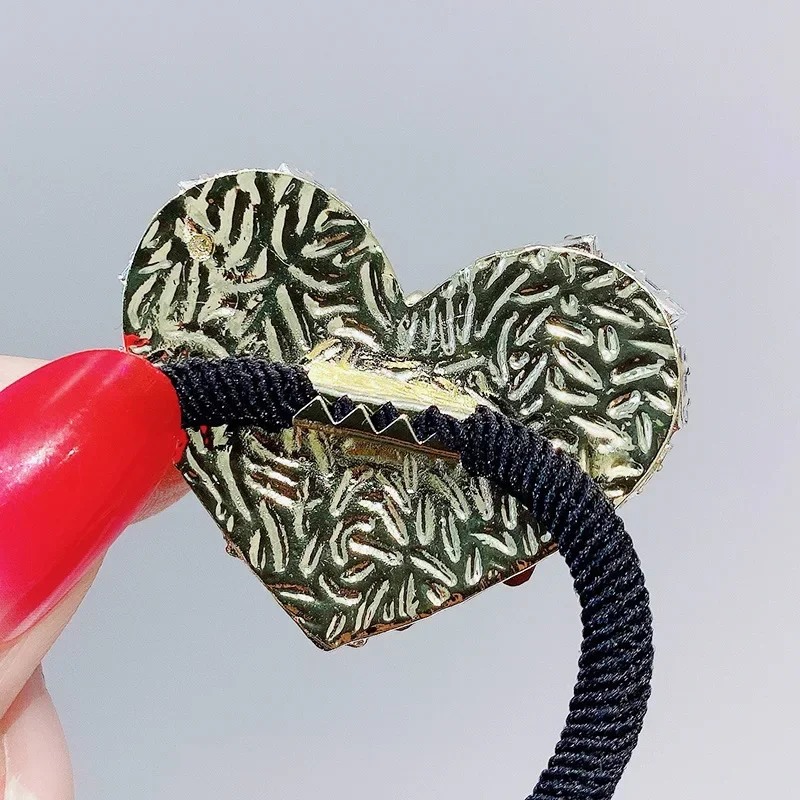 Moda strass cuore elastico fasce per capelli archi donne ragazze gioielli di lusso corda per capelli cravatta accessori per capelli squisiti coreani