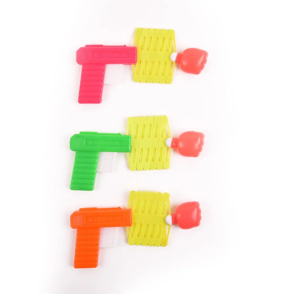 10PCS kinder spielzeug pistole kreative teleskop faust pistole mini lustige elastische frühling magische pistole kleines spielzeug