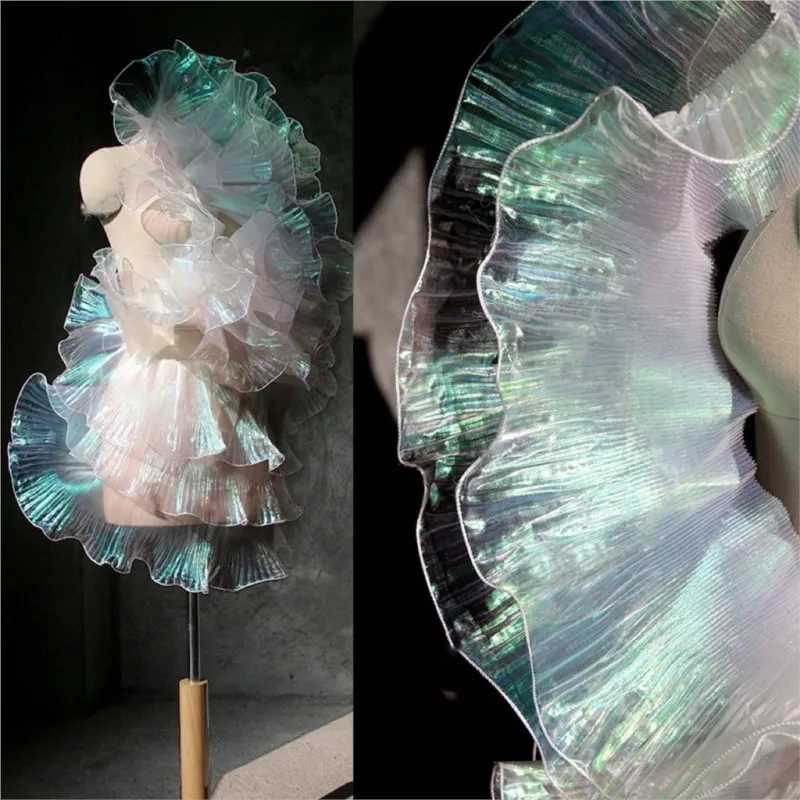 A designer evening dress decorated with fringed pleated iridescent gradient Organza fabric