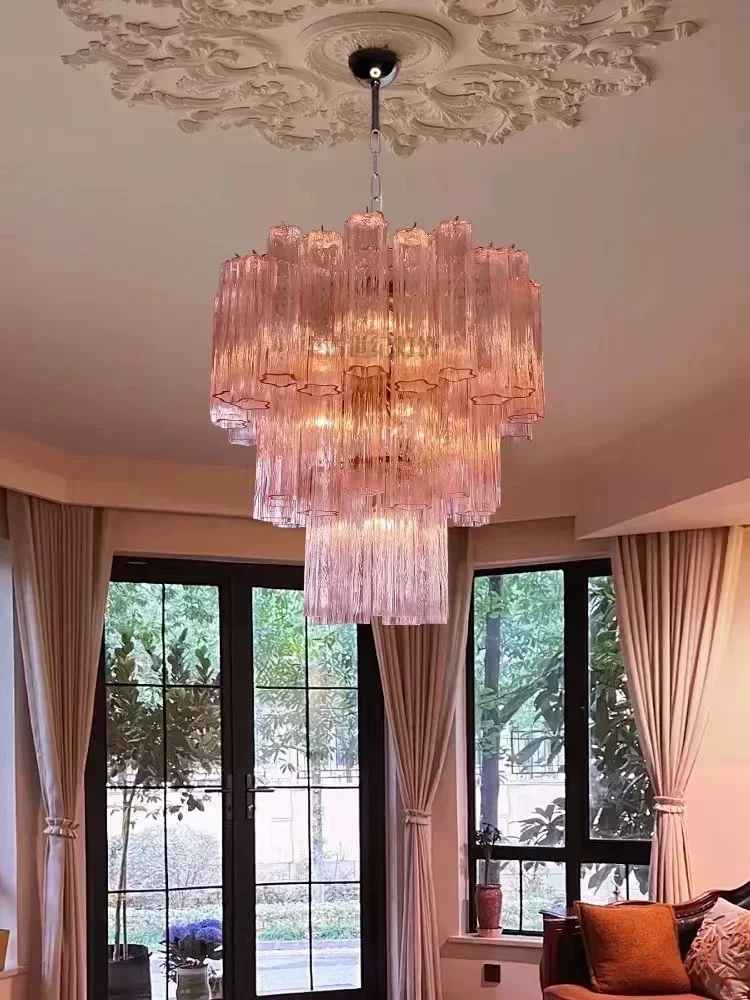 

Italian designer's retro textured glass chandelier, featuring a transparent pink hue, serves as an elegant home decor piece suit