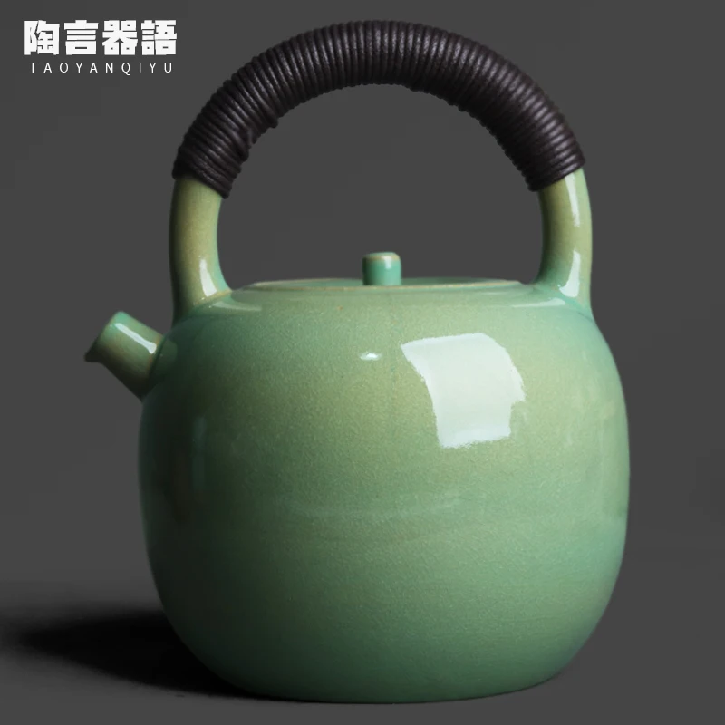 “Fruit green soda-glazed rough earthenware round teapot with rattan handle for charcoal or electric burners”