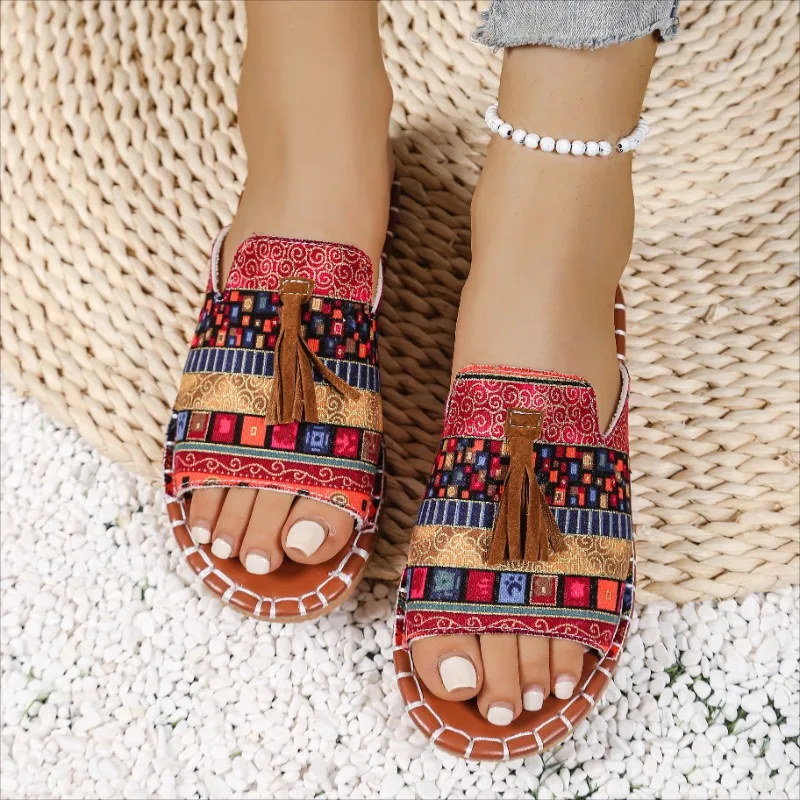 Pantofole con nappe stile nazionale per donna 2025 Primavera ed estate Nuove mezze pantofole con punta aperta in sughero piatto versatile retrò Taglie forti