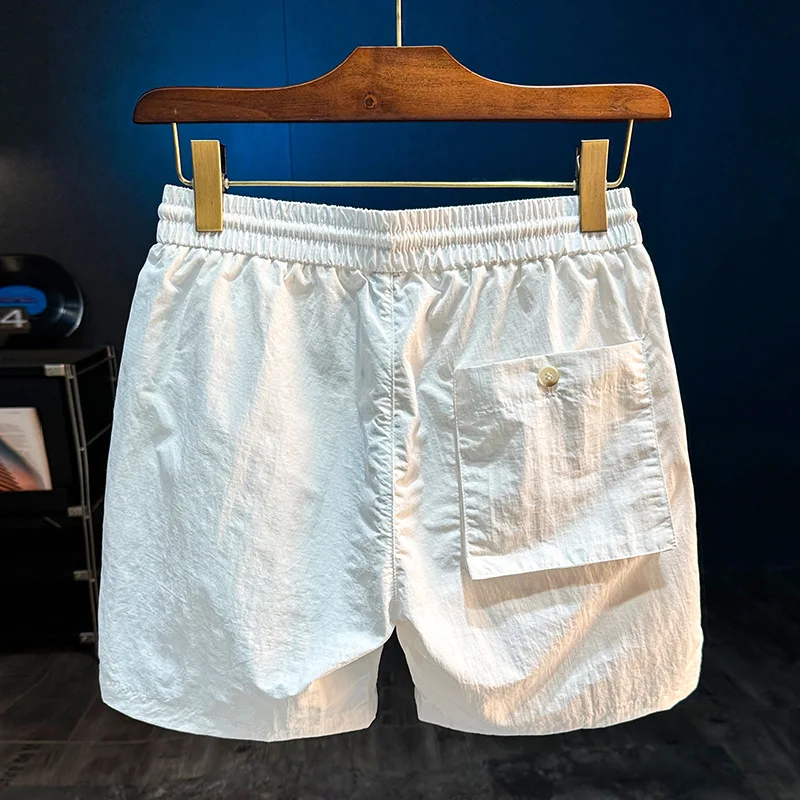 

2025 летние новые мужские шорты, повседневные универсальные модные утягивающие дышащие простые однотонные пляжные брюки