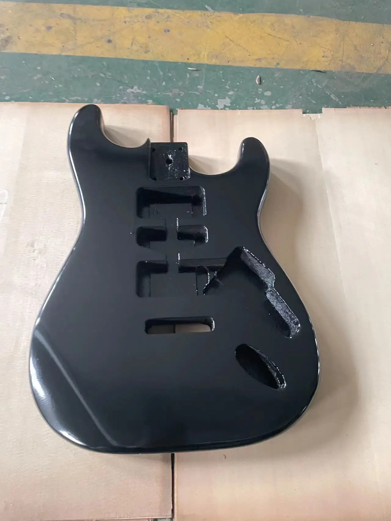 The black glossy guitar panel is an ST style electric guitar with a half empty heart barrel DIY guitar. The colored guitar body