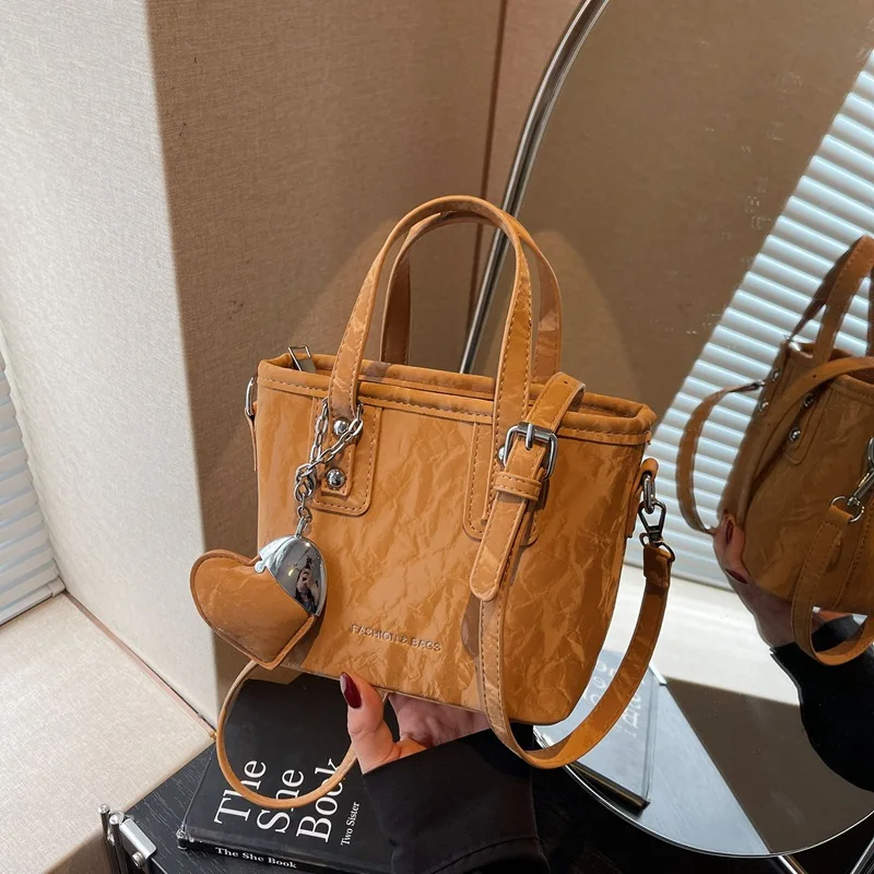 

Однотонная сумка-ведро 2025 года, минималистичный женский кошелек с верхней ручкой, шикарная сумка через плечо, нишевая сумка «день-ночь»