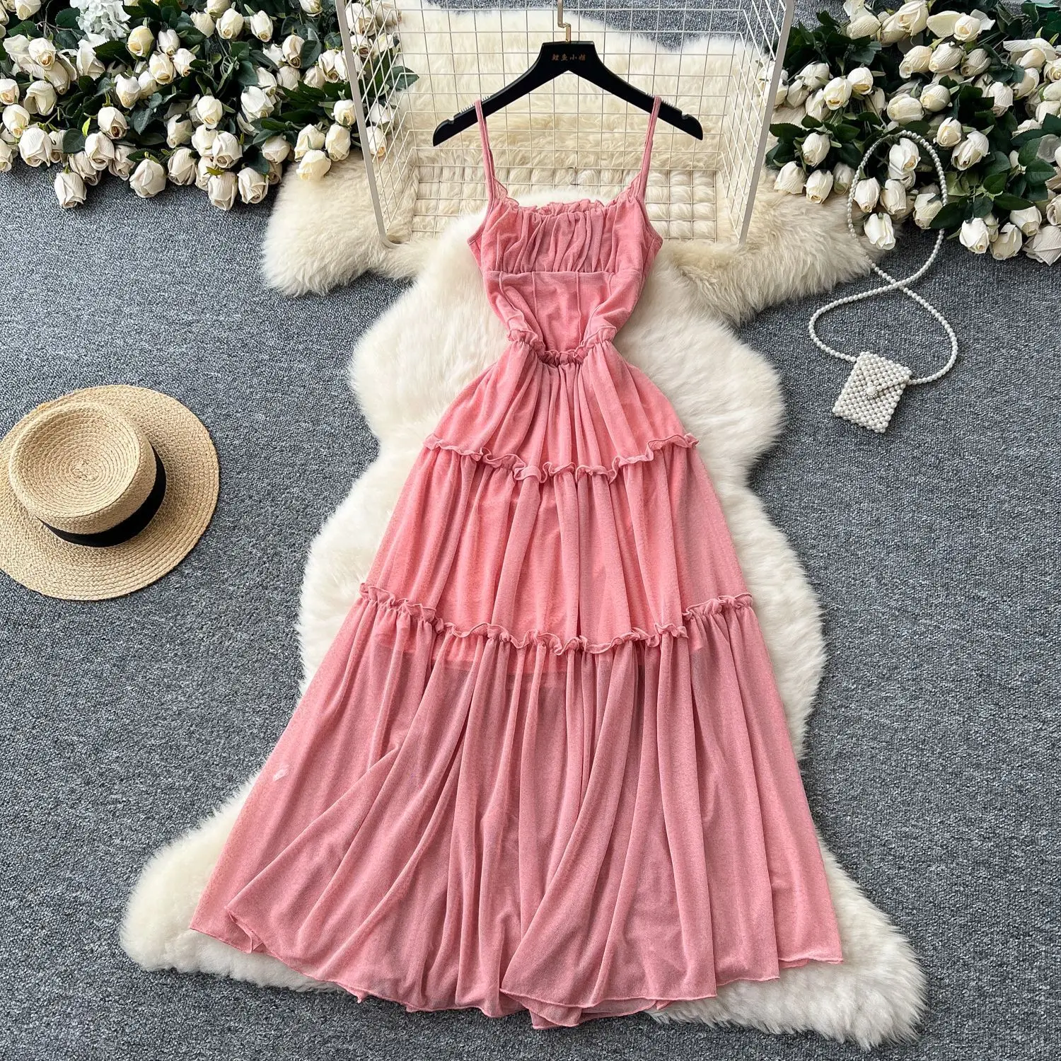 Retro halter dress for women with beachy style, featuring pleated and wide hemmed long skirt.