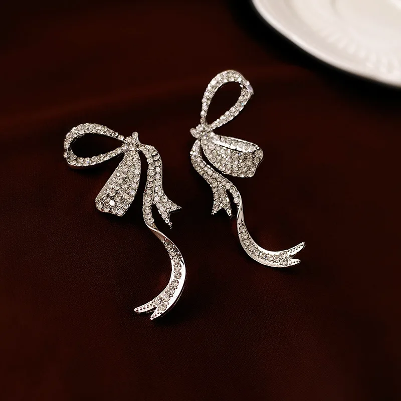 Light luxury style diamond-encrusted bow streamer silver needle earrings Fashion,elegant temperament and high-end,sensual