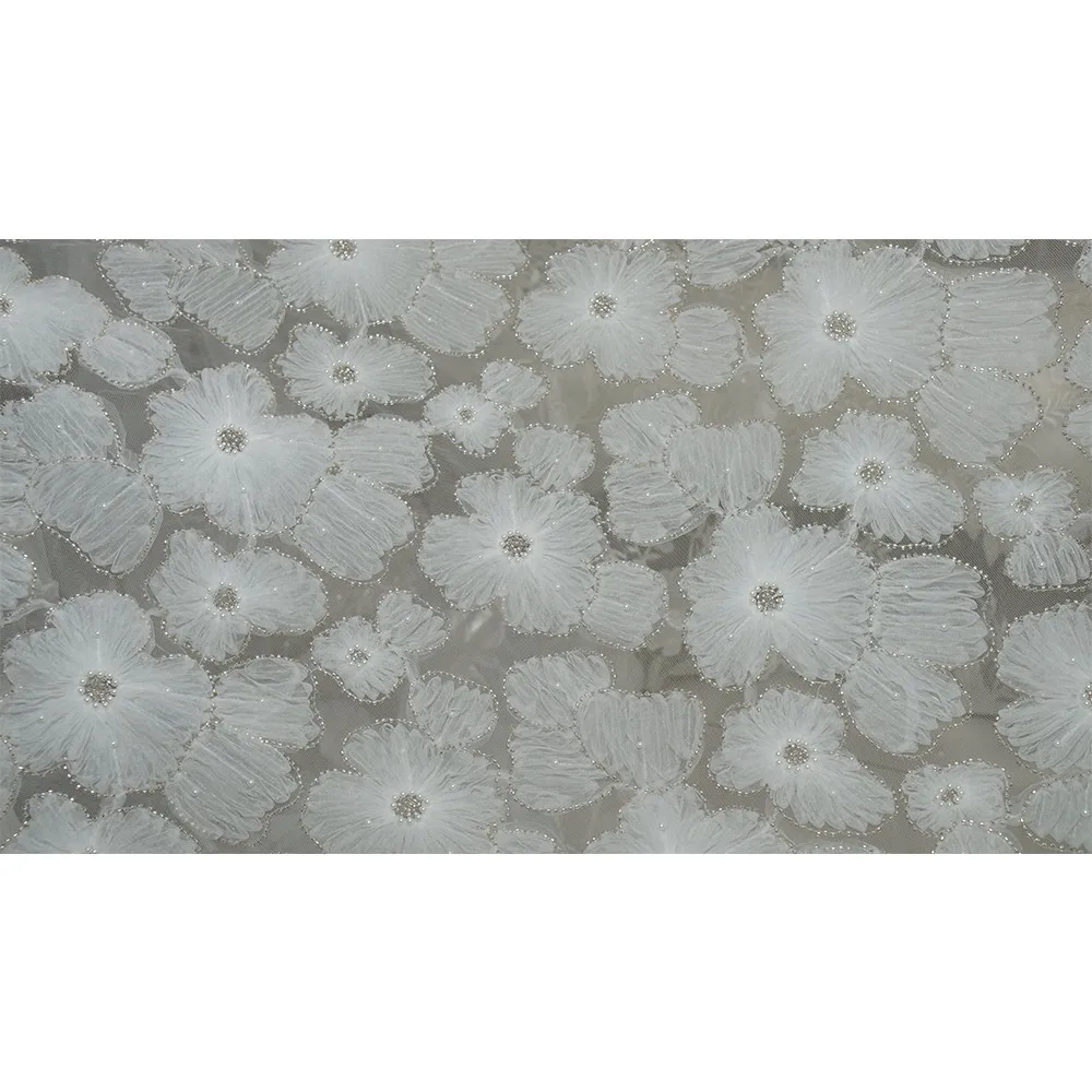 The new irregular three-dimensional floral beaded and sequined lace fabric is suitable for wedding parties